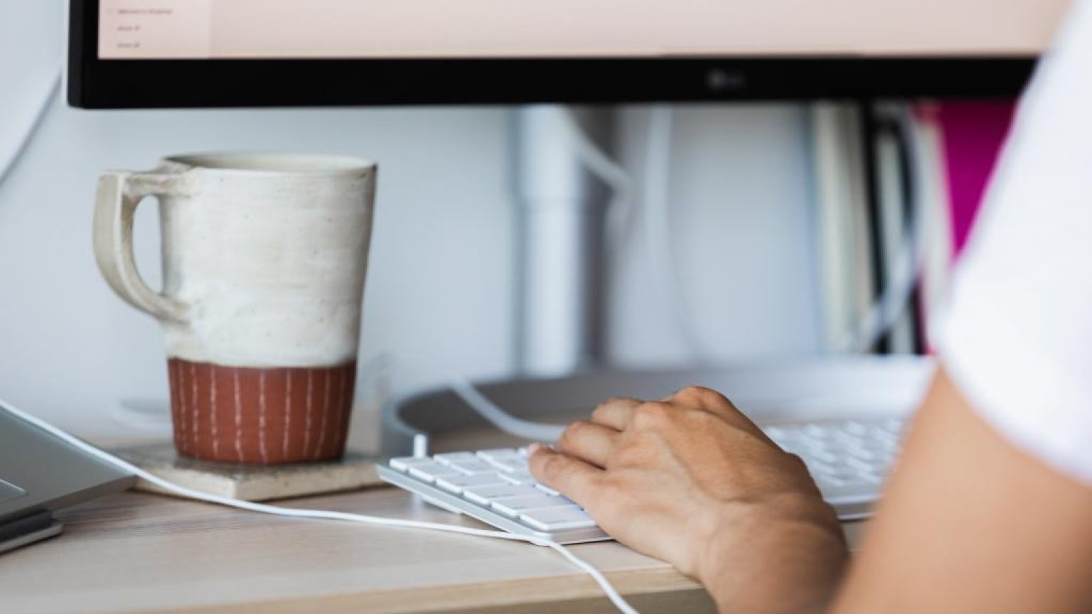 Hands typing away on the keyboard 1024x683