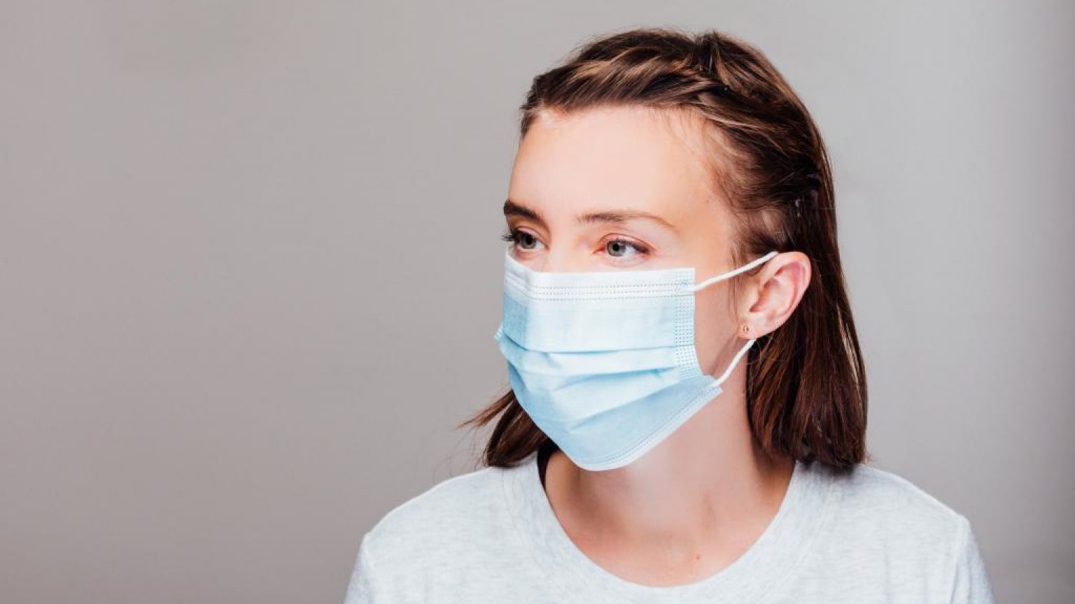 Portrait of a woman wearing disposable face mask 1024x683