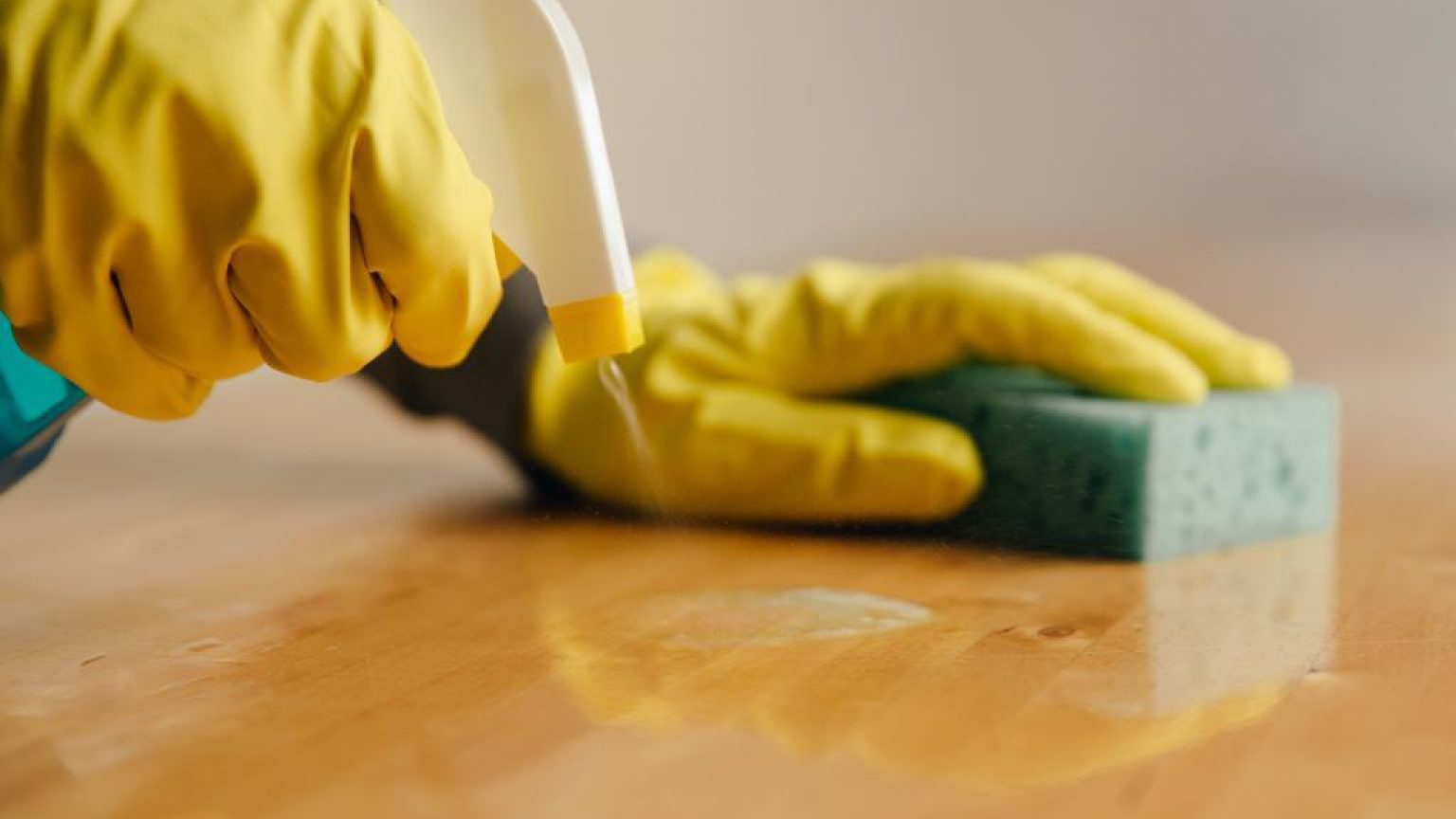 Spraying cleaner on wood 1024x682